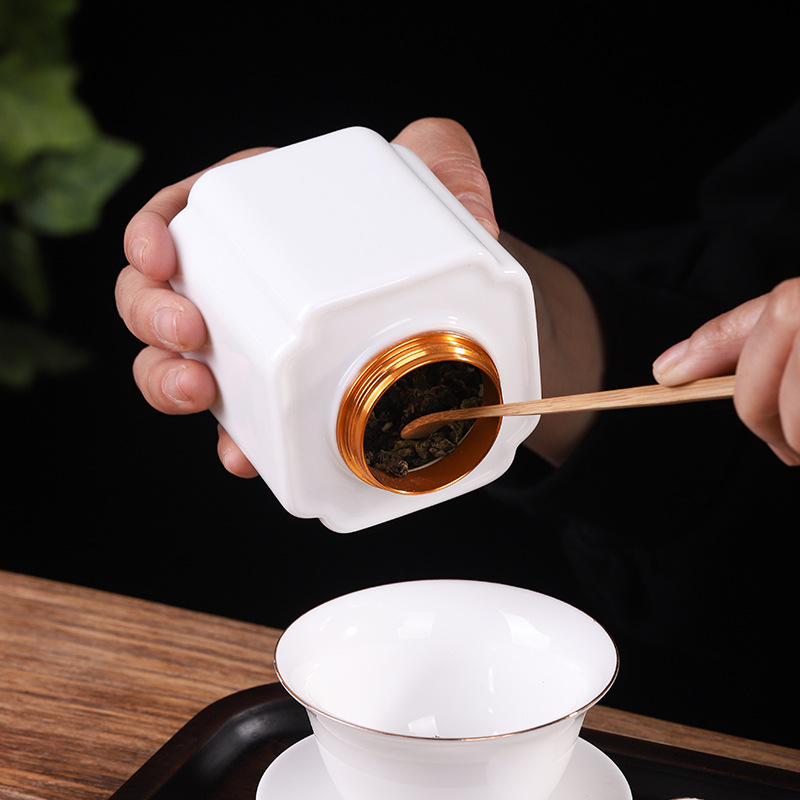 Mỡ cừu trắng tinh khiết Ngọc sứ trà lon thiếc gốm sứ niêm phong lọ tiết kiệm quà tặng bán buôn hộp trà cầm tay