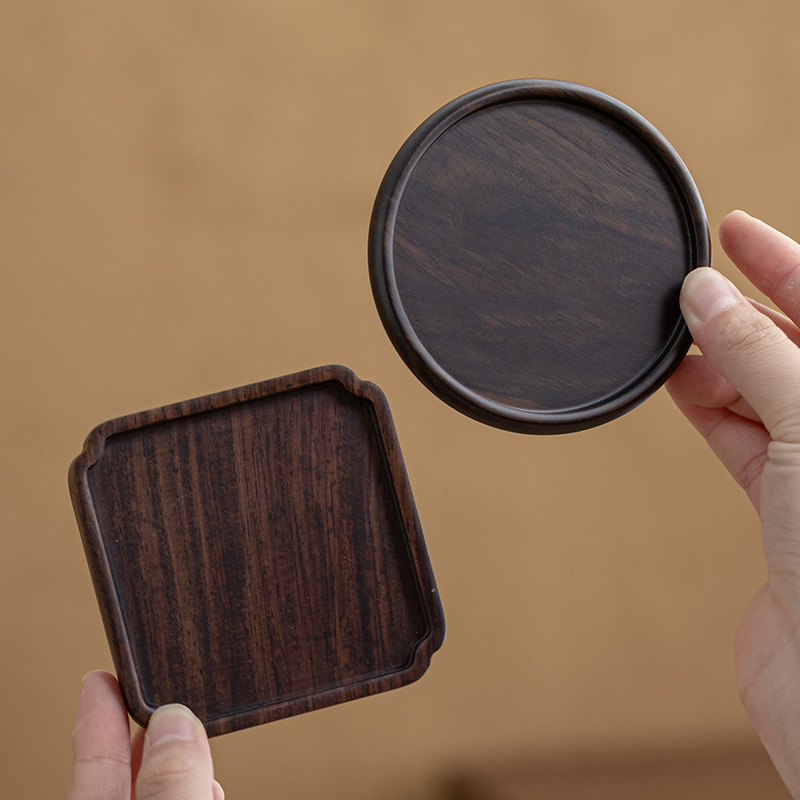 Lót tách trà gỗ solid gỗ mun Lót tách trà Trà đạo Kung Fu Lót tách trà Phụ kiện bộ trà sáng tạo cách nhiệt bằng gỗ