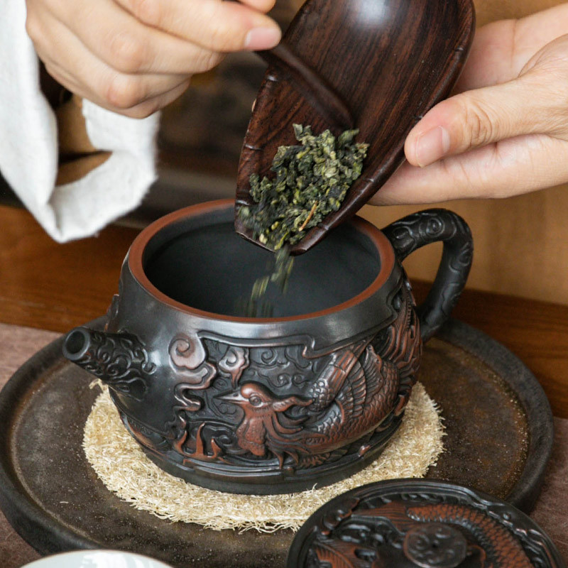 Ấm trà gốm tím ấm trà gốm sứ rồng phượng Hán dụng cụ pha trà Kung Fu gia dụng chạm khắc thủ công dung tích lớn Vân Nam Jianshui
