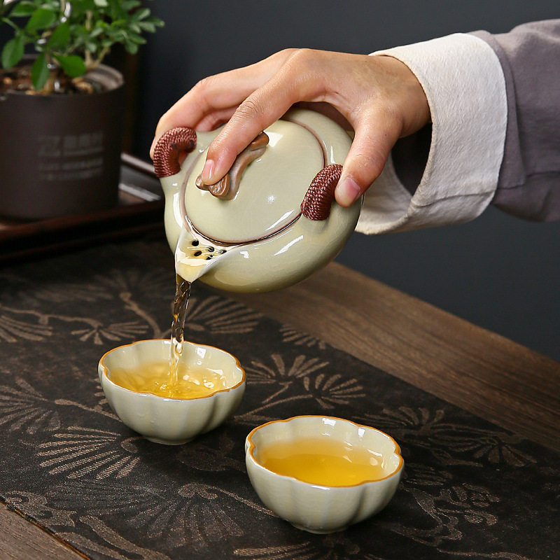 Bộ trà du lịch Ruyao cốc khách nhanh đơn giản cao cấp cầm tay pha trà ngoài trời một bình hai cốc bộ bốn cốc