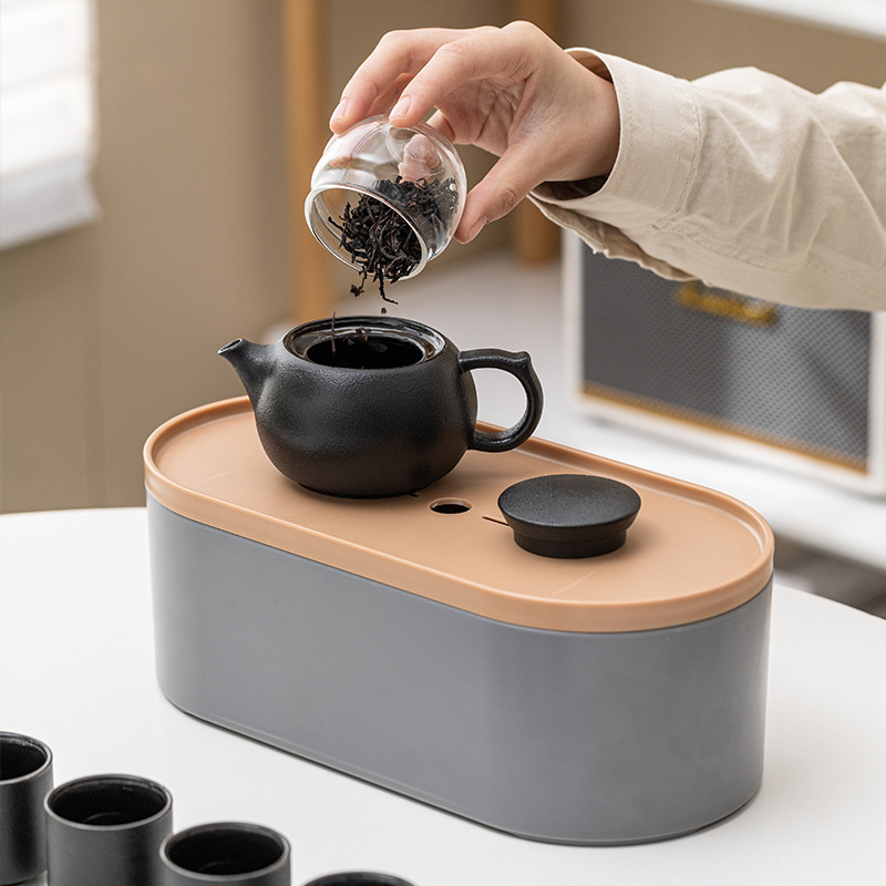 Bộ ấm trà du lịch trọn Bộ gốm sứ cắm trại ngoài trời cốc khách nhanh một ấm bốn cốc ấm trà Kung Fu quà tặng doanh nghiệp