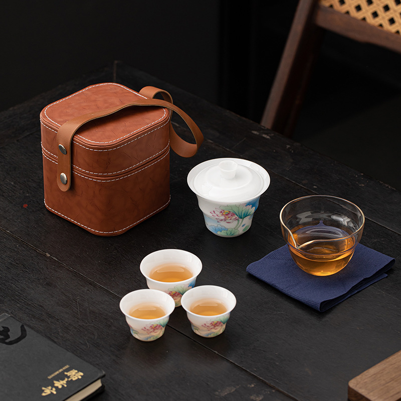 Bộ trà du lịch hoa sen bằng sứ ngọc bích phong cách Trung Quốc mới ngoài trời di động nhanh cốc gốm sứ một bát ba cốc trà