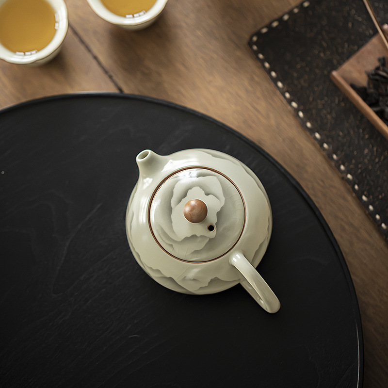 Pengshan Ruyao Mountain Ruhua Xi Shi Ấm trà gốm sứ gia dụng cổ điển Bộ trà Kung Fu Ấm trà bóng lỗ lọc Bình đơn