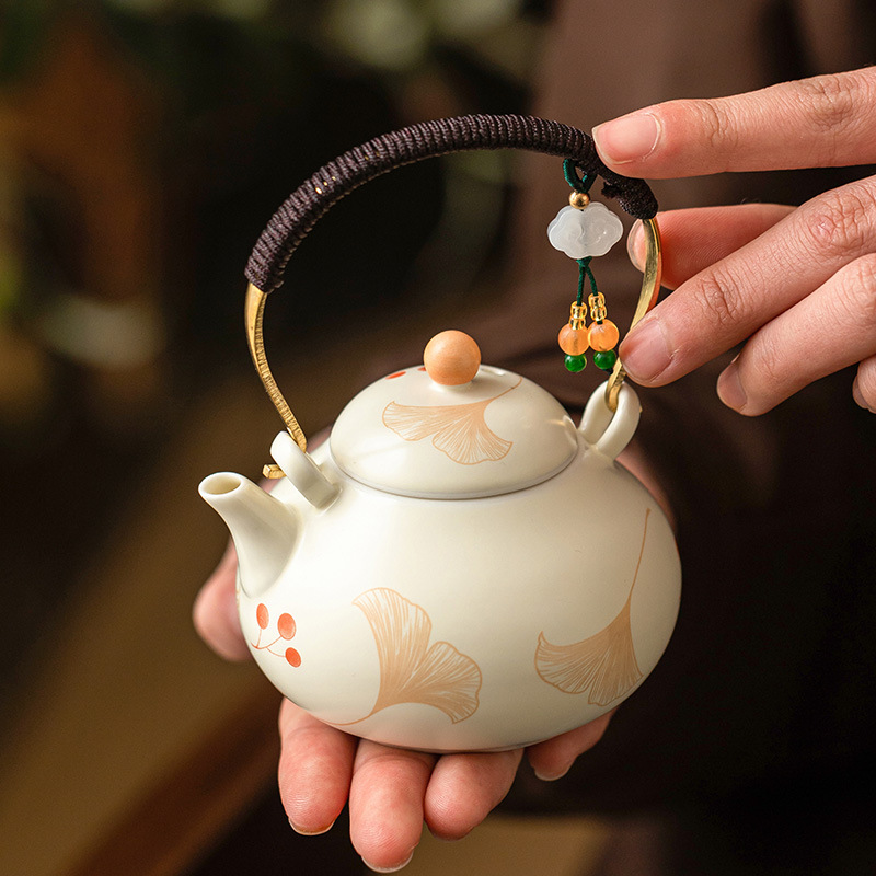 Ấm trà chùm dây buộc bạch quả màu be ấm trà gốm sứ pha trà dụng cụ trà kungfu gia dụng lọc ấm trà đơn ấm trà nhỏ kiểu Trung Quốc