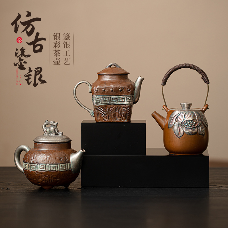 Ấm trà mạ bạc cổ phong cách Trung Quốc ấm trà gốm sứ gia dụng ấm tay cầm chùm dụng cụ trà Kung Fu ấm trà lọc lỗ bóng ấm đơn