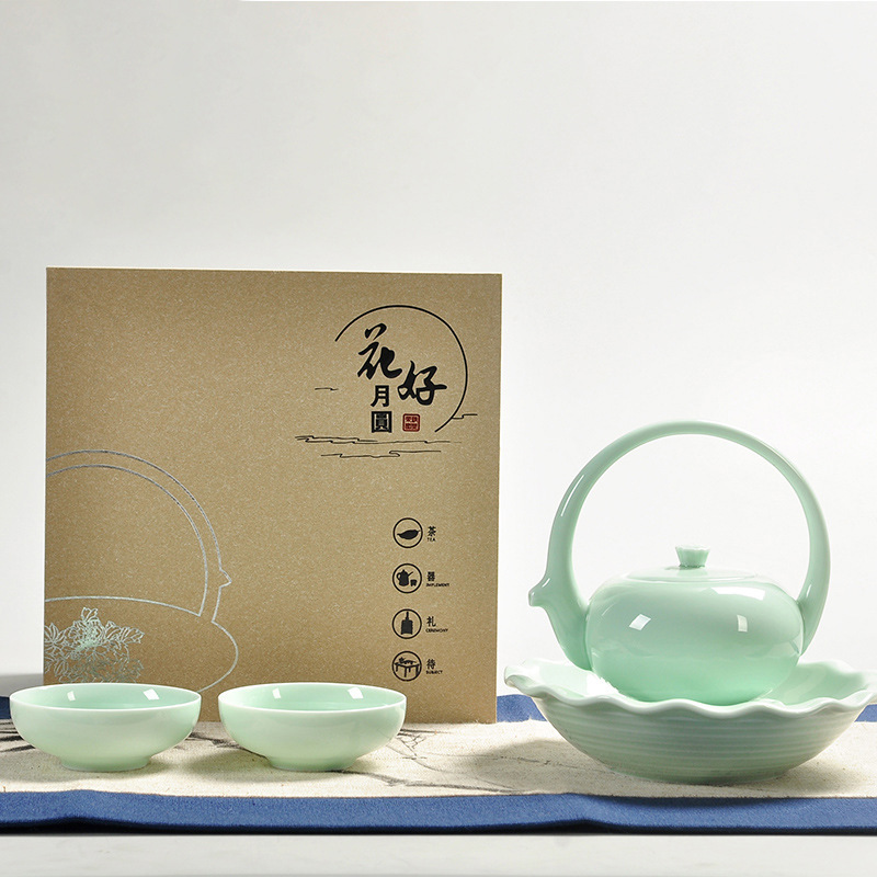 Dụng cụ trà gốm sứ Yingqing nhỏ cầm xà một ấm bốn cốc gia dụng gia dụng quà tặng gia dụng ấm trà văn phòng bộ hộp quà
