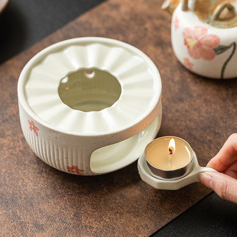 Quạt chạm khắc hình hoa chuông bếp ấm trà gốm sứ nến cồn nấu trà bếp đun trà dụng cụ đun trà chân đế đun ấm trà