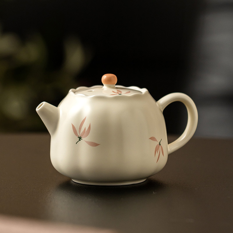 Ấm trà nụ hoa lan tráng men màu vàng gạo ấm trà gia dụng dụng dụng cụ trà gốm sứ kiểu Trung Quốc dung tích lớn ấm trà Kung Fu cầm tay cầm