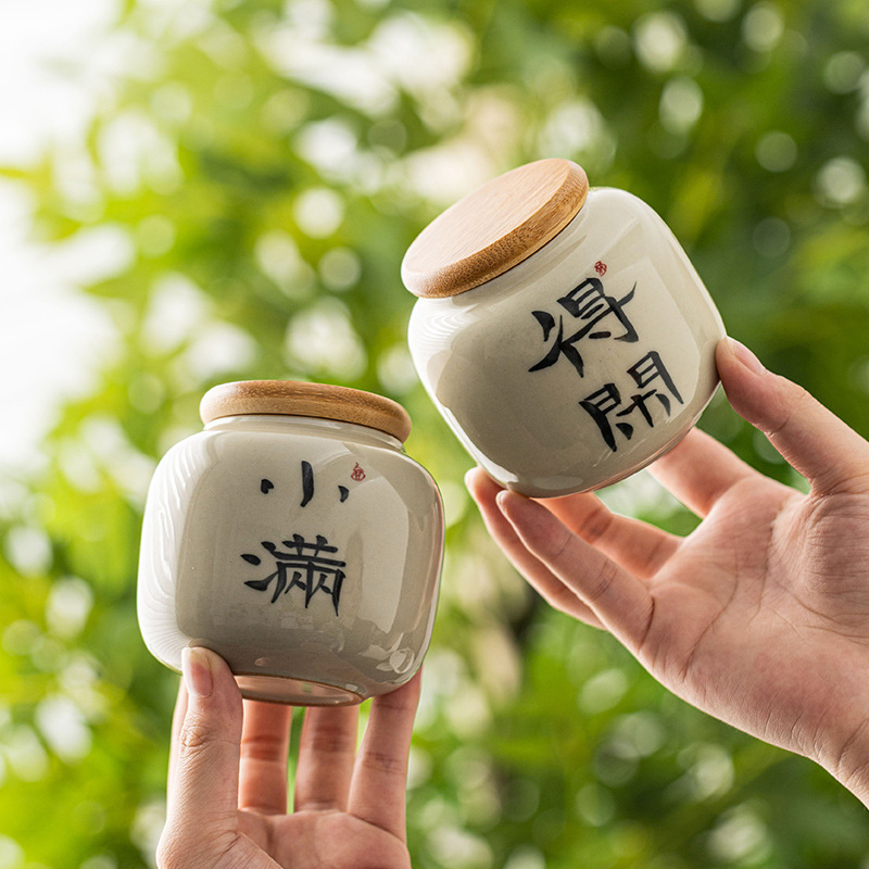 Hộp đựng trà màu xám cỏ thư pháp, hộp kín gốm, trà đen Pu'er, hộp đựng trà rỗng, hộp đựng trà mini cầm tay nhỏ