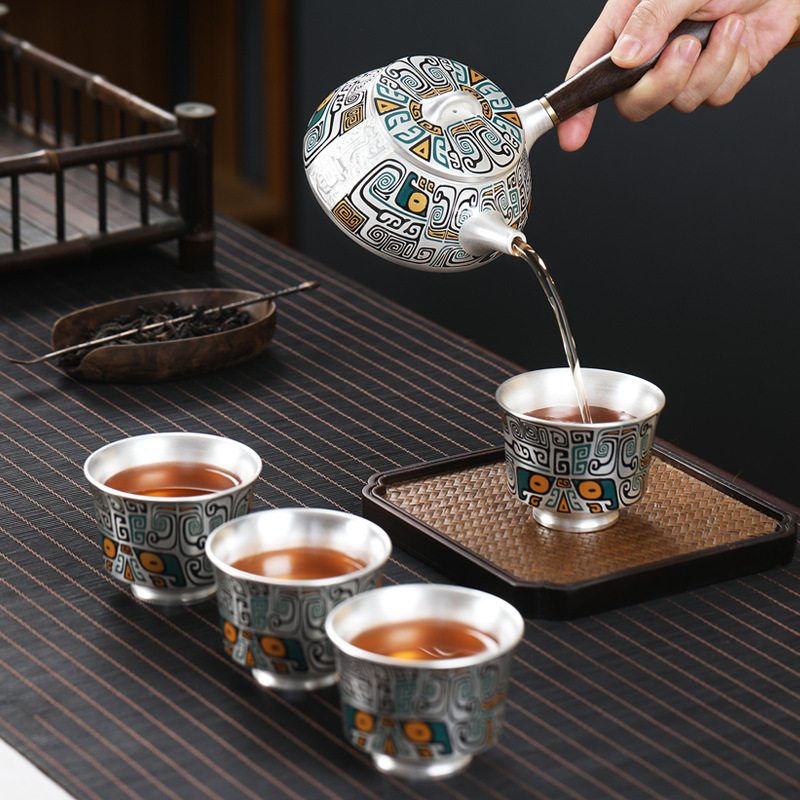 Bộ trà du lịch cầm tay cầm tay văn phòng kiểu Nhật Bản một bình bốn cốc bạc 999 sterling