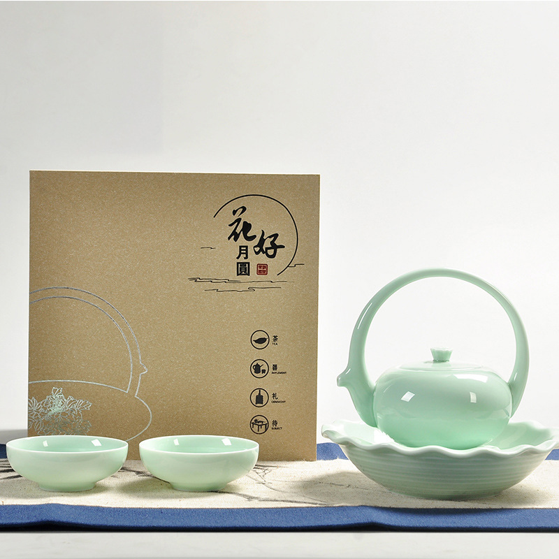 Dụng cụ trà gốm sứ Yingqing nhỏ cầm xà một ấm bốn cốc gia dụng gia dụng quà tặng gia dụng ấm trà văn phòng bộ hộp quà