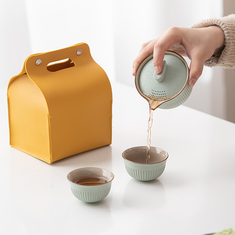 Bộ trà du lịch một ấm hai cốc Bộ trà Kungfu gốm sứ Đồ lưu niệm lễ hội Đồ pha trà lười cắm trại