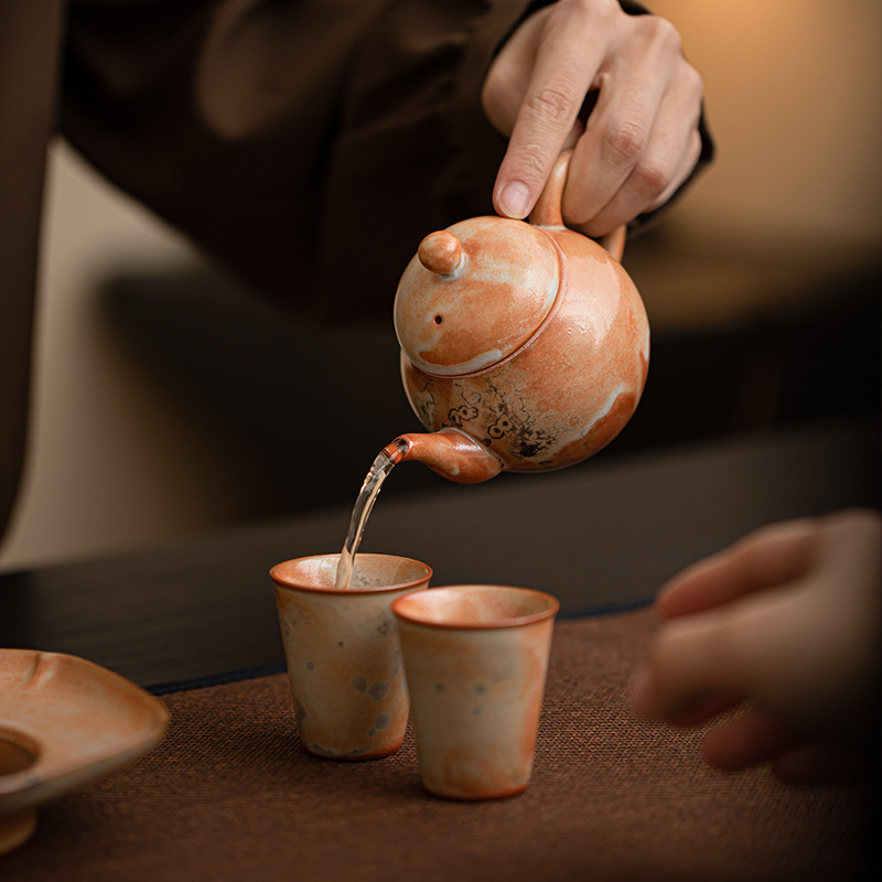 Shino-yaki hình quả lê ấm trà retro kung fu bộ trà hộ gia đình lò quay gốm bóng lỗ lọc ấm trà nồi đơn hộp quà tặng