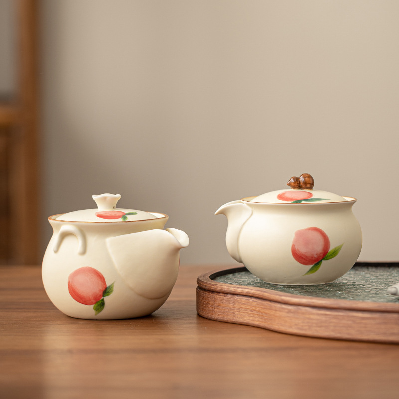 Màu hồng vẽ tay gốm sứ màu be nước đào nắm tay ấm chén cá nhân bộ trà Kung Fu bộ quà tặng bán buôn