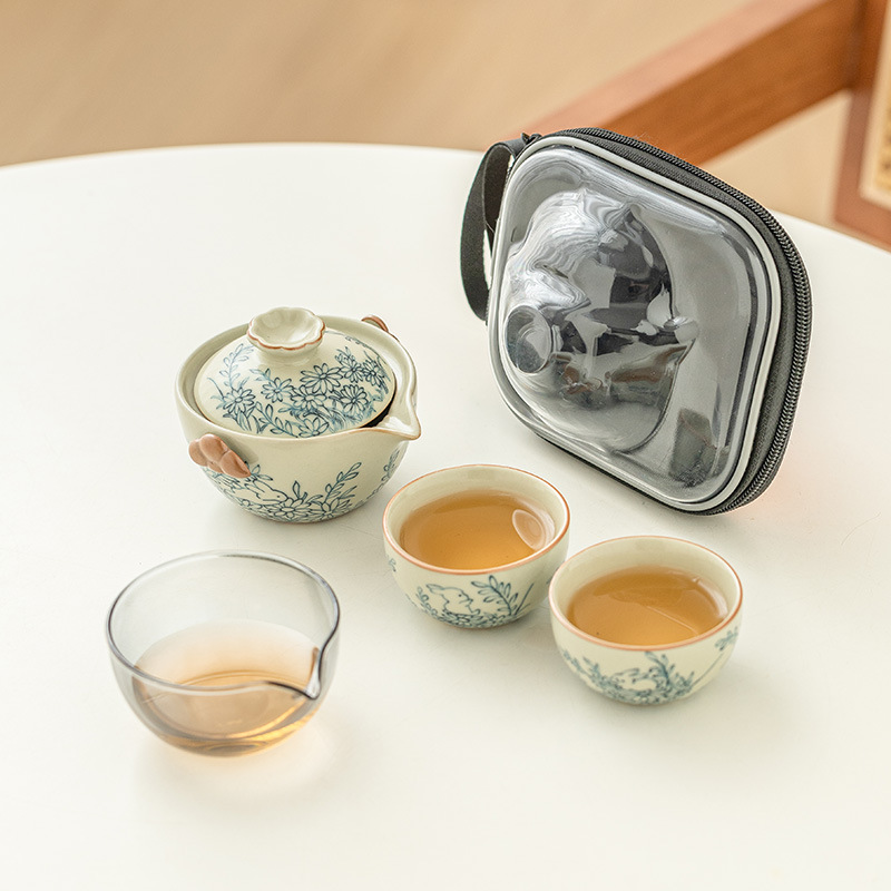 Hoa hướng dương Mengtu Ru lò một bình hai cốc bộ ấm trà du lịch ngoài trời di động ấm trà gốm sứ kiểu Trung Quốc