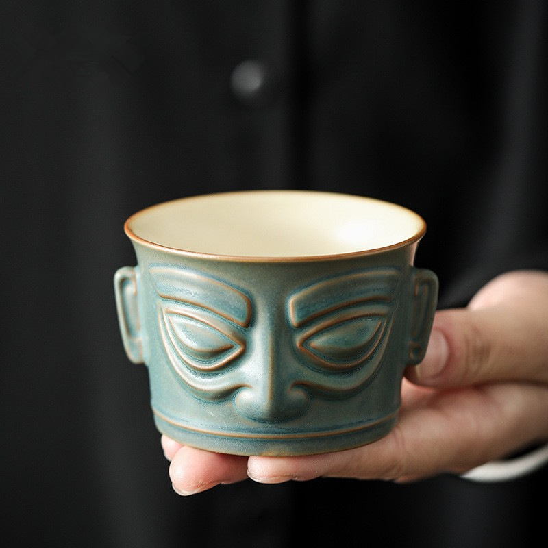 Cốc chủ nhân mặt nạ đồng Sanxingdui cốc đơn cốc trà Kung Fu gốm sứ đơn phong cách Trung Quốc cổ điển bát trà nhỏ