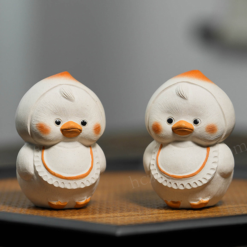 Đồ trang trí vịt vật nuôi trà cát tím quặng thô Yixing Đào Bộ trà điêu khắc Vịt Vàng nhỏ bàn trà sáng tạo chơi trà bán buôn