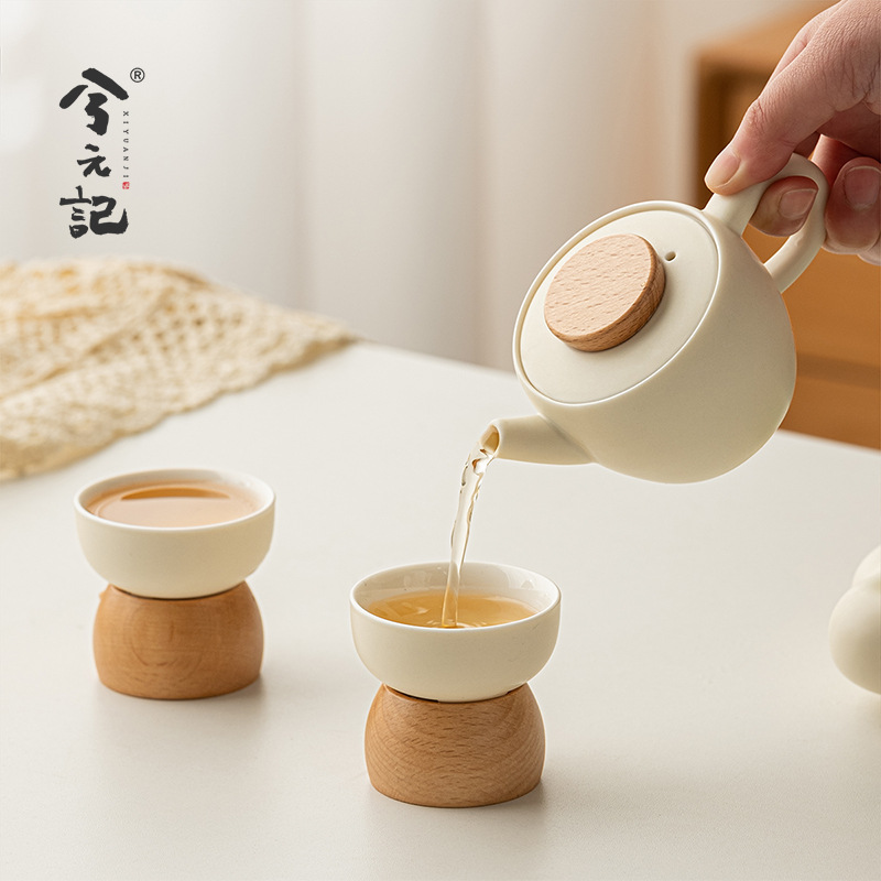 Bộ ấm trà Kung Fu phong cách kem ấm trà gốm sứ cao cấp sang trọng nhẹ gia dụng bộ nhỏ hộp quà