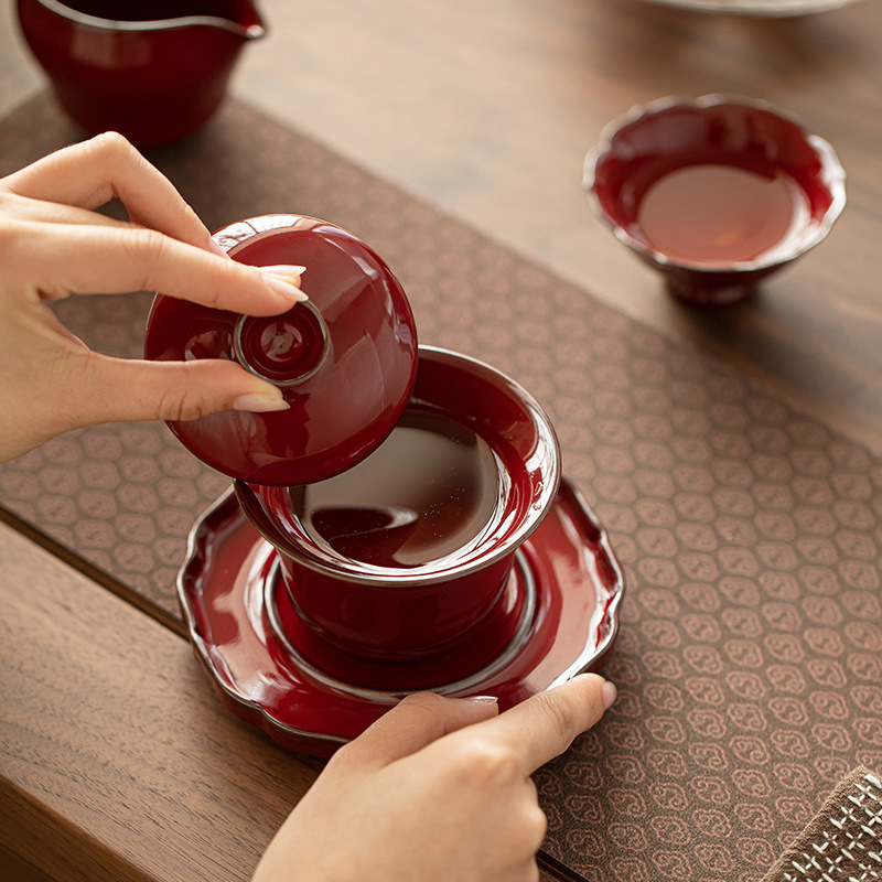 Xuyên biên giới Jingdezhen Lò nung biến thành màu đỏ Tử Cấm Thành Màu đỏ Tam tài có nắp Bộ trà gốm sứ Bát có nắp hình móng ngựa trọn bộ với giá đỡ dưới