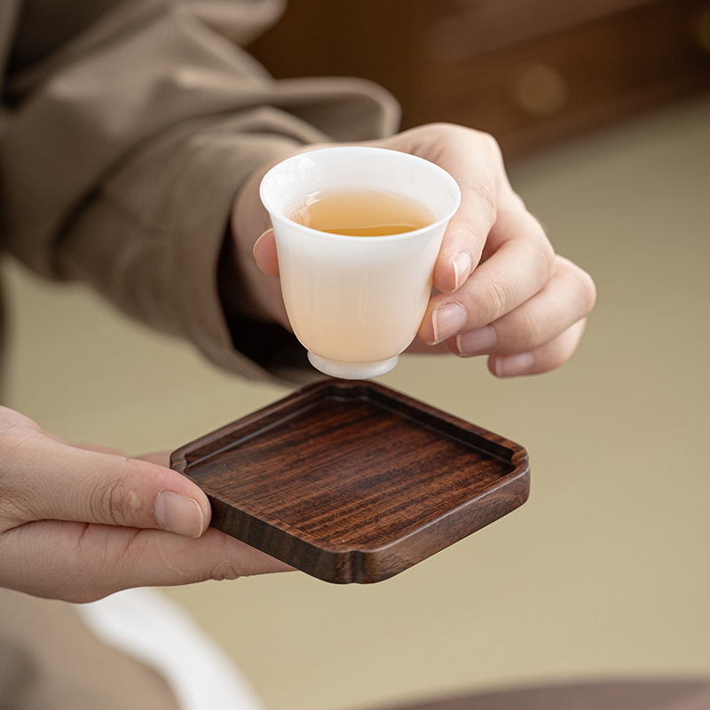 Lót tách trà gỗ solid gỗ mun Lót tách trà Trà đạo Kung Fu Lót tách trà Phụ kiện bộ trà sáng tạo cách nhiệt bằng gỗ
