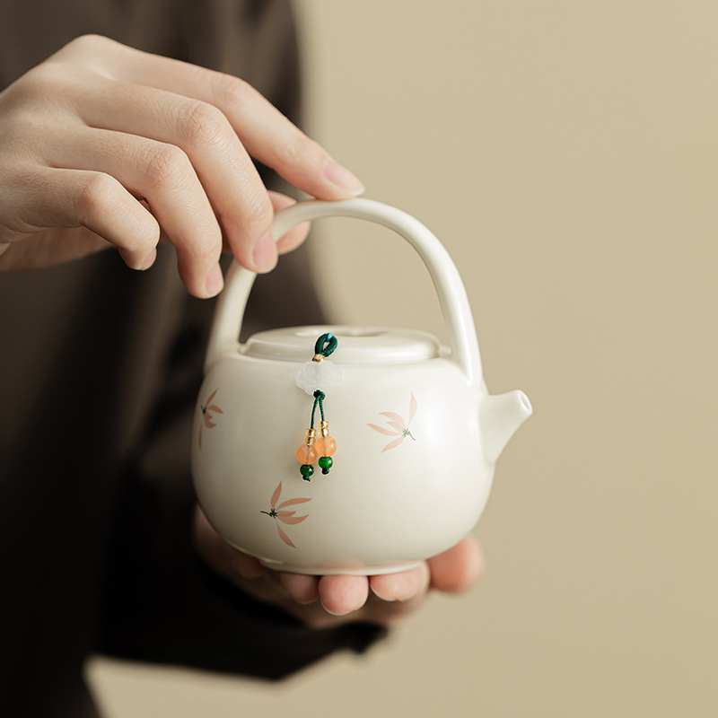 Phong lan chuông gió màu be vàng Ding lò nung chùm ấm pha trà cầm tay gốm sứ dụng cụ pha trà Kung Fu dụng cụ pha trà lỗ bóng dụng cụ pha trà