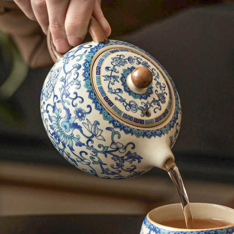 Ấm trà gốm sứ ấm trà ấm trà gia dụng Ru lò trắng xanh quấn cành sen Xi Shi bộ trà cao cấp kiểu Trung Quốc ấm trà cầm tay