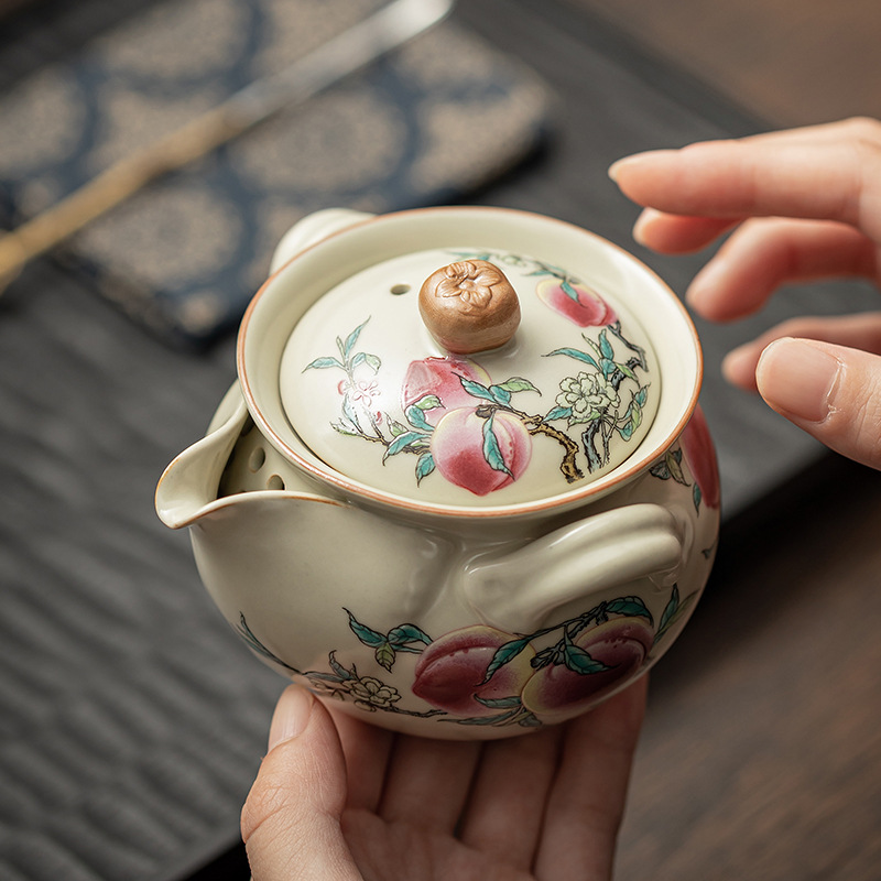 Ấm cầm tay chín đào ở lò Ru ấm trà gia dụng bát trà gốm sứ chống bỏng tách trà bộ ấm trà có thể giữ ấm hộp quà tặng