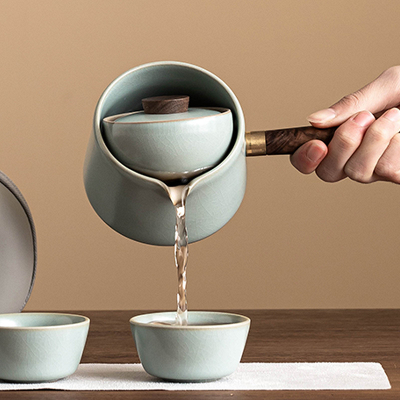 Bộ dụng cụ pha trà ấm tay cầm bên lò Thiên Thanh Ru sáng tạo xoay ấm trà pha trà gia dụng ngoài trời không nóng một ấm ba chén