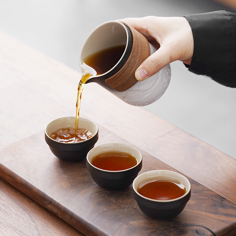 Bộ trà Kung Fu du lịch gốm sứ túi xách tay một ấm bốn cốc xe hơi nhanh cốc cắm trại ngoài trời ấm pha trà