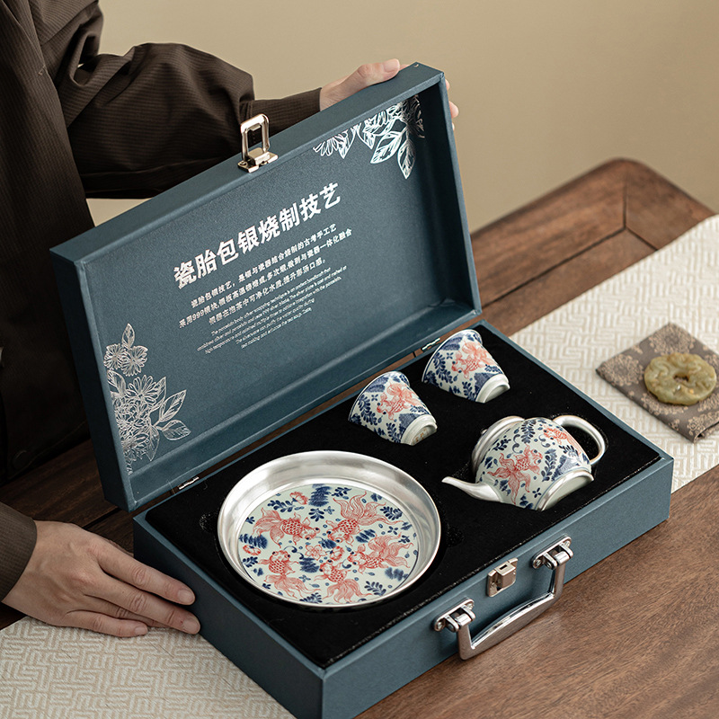 Bộ trà một ấm hai tách cá bạc chơi trong nước Bộ trà gốm sứ gia dụng Trung Quốc tặng quà doanh nghiệp cho người lớn tuổi