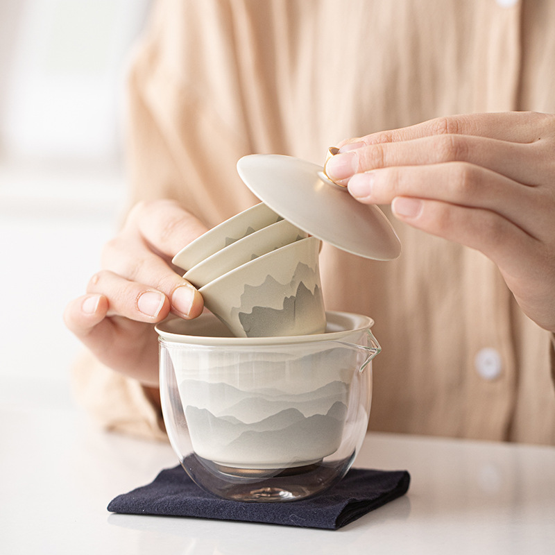 Bộ trà du lịch đựng gốm sứ cầm tay cốc khách nhanh một ấm bốn cốc cắm trại ngoài trời cốc trà Kung Fu ấm pha trà