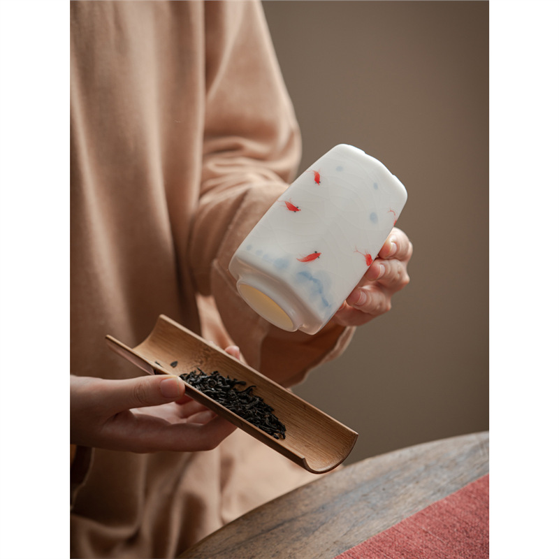 Chũ trà chơi cá vẽ tay, bình kín, bình đựng trà gốm sứ lò Ru trắng, quà lưu niệm gia dụng chống ẩm cổ điển kiểu Trung Quốc