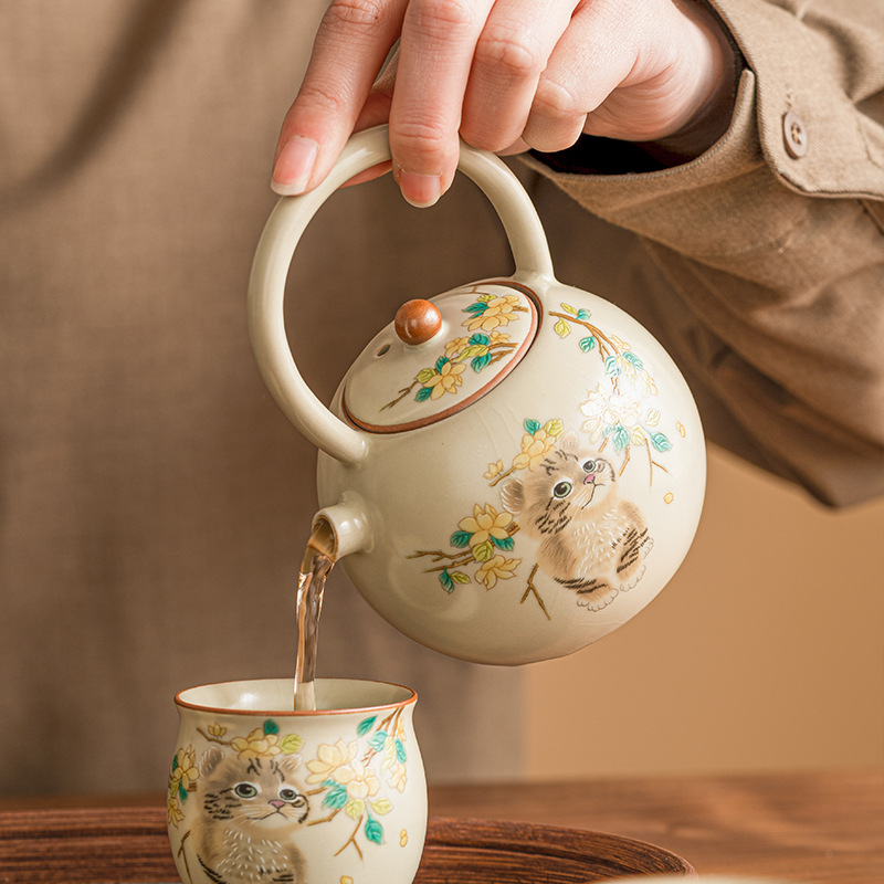 Bộ dụng cụ trà ấm trà ấm trà ấm trà nhỏ pha trà gia dụng ấm đơn có nắp mở bằng gốm Sứ có thể nâng