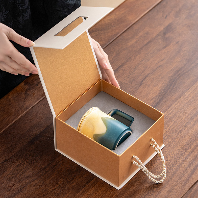 Cốc tách trà nước Jianshan cốc pha trà gốm sứ giá trị cao cốc lọc có nắp hộp quà logo