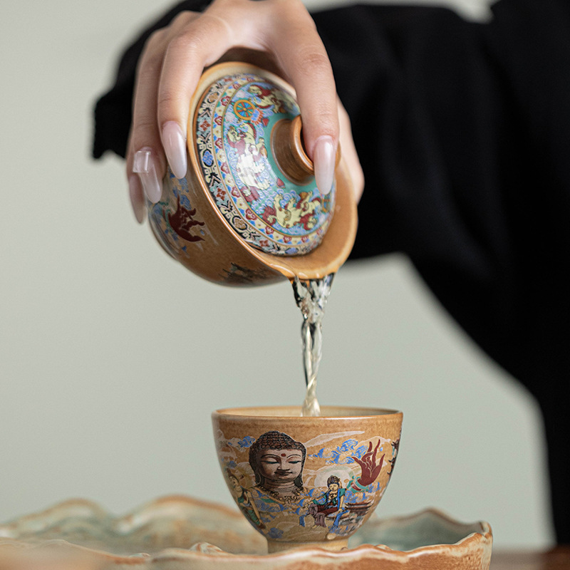 Bộ trà du lịch tượng Phật Đôn Hoàng một ấm bốn cốc du lịch ngoài trời di động Bộ trà Kung Fu gốm sứ gia dụng