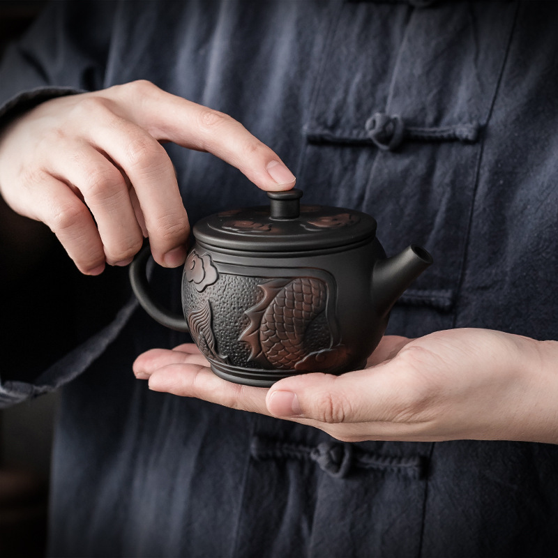 Ấm trà Gốm Tím dụng cụ trà gốm sứ gia dụng Kung Fu ấm trà cầm tay Gốm Tím ấm pha trà cầm tay