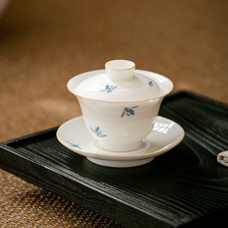 Vẽ tay phong lan trắng sứ nắp bát trà cốc trà đơn ba tài năng bộ trà gốm sứ kungfu bán buôn cốc trà