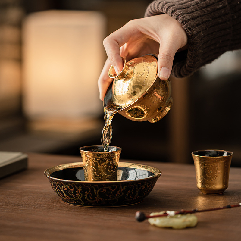 Song Yu mạ vàng hoa văn Chilong một bát hai cốc bộ ấm trà gốm sứ gia dụng nắp cốc trà bộ trà hộp quà tặng
