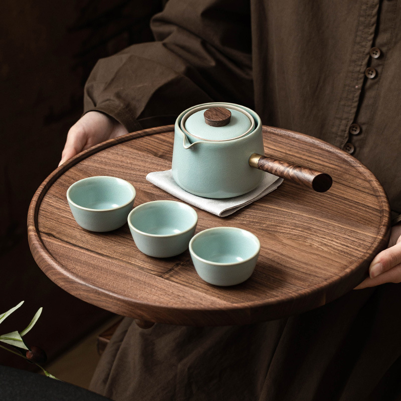 Bộ dụng cụ pha trà ấm tay cầm bên lò Thiên Thanh Ru sáng tạo xoay ấm trà pha trà gia dụng ngoài trời không nóng một ấm ba chén