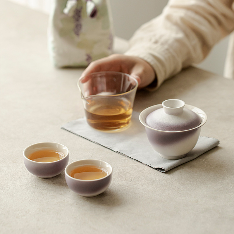 Bộ trà du lịch gốm sứ Chupu một ấm hai cốc ngoài trời đựng túi vải lưu trữ quà lưu niệm sáng tạo kiểu Trung Quốc