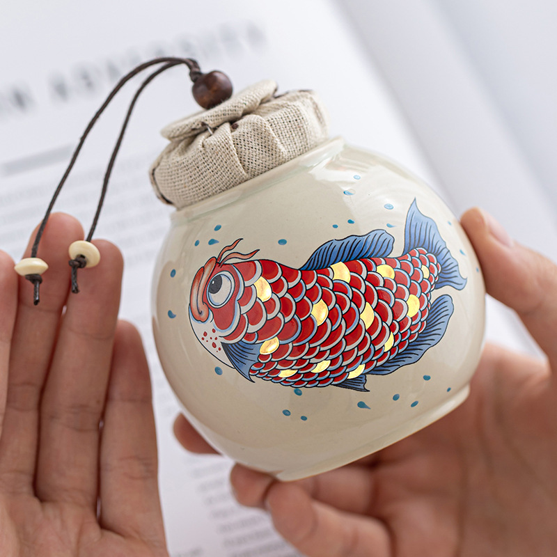 Thùng trà kho báu tròn màu xám thực vật Thùng trà nhỏ lưu trữ cao cấp Jinyu Mantang Thùng trà cầm tay Thùng kín Hộp trà Thùng trà