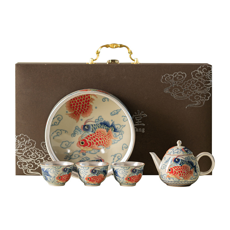 Bộ ấm trà Kung Fu gốm sứ một ấm ba chén cá rồng bạc bạc gia dụng tặng quà cho lãnh đạo và khách hàng