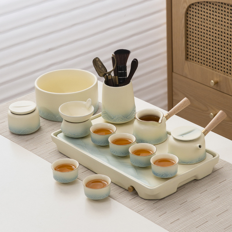 Bộ trà Qianli Jiangshan Bộ trà bàn trà trọn bộ kem phong cách pha trà nắp ấm trà gốm sứ Bộ đồ nữ tinh tế