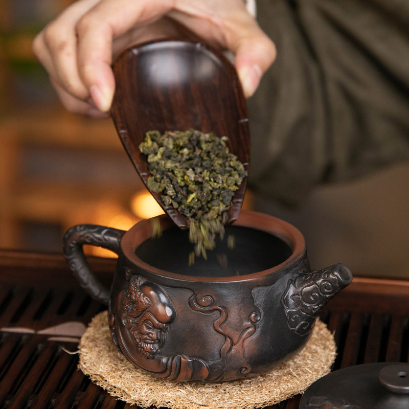 Ấm trà gốm tím Hanwa có thể nâng và xoay ấm trà đất sét tím Dama nước xây thủ công Bộ ấm trà Kung Fu gia dụng