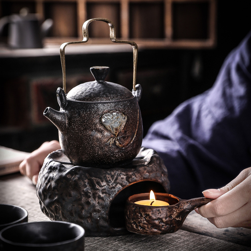 Bộ ấm trà Bộ ấm áp Bộ ấm trà nến ấm cơ sở trà ấm chén một ấm bốn tách Bộ trà Kung Fu bộ nhỏ