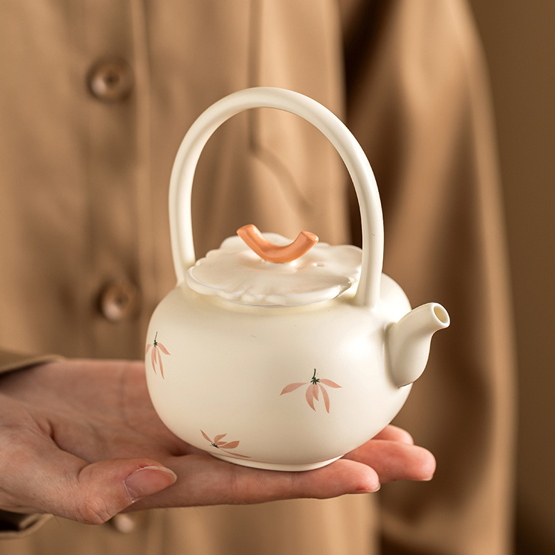 Ấm trà hoa lan tráng men màu vàng ấm trà ấm trà dụng cụ trà Kung Fu gốm sứ gia dụng ấm trà pha trà dung tích lớn cao cấp