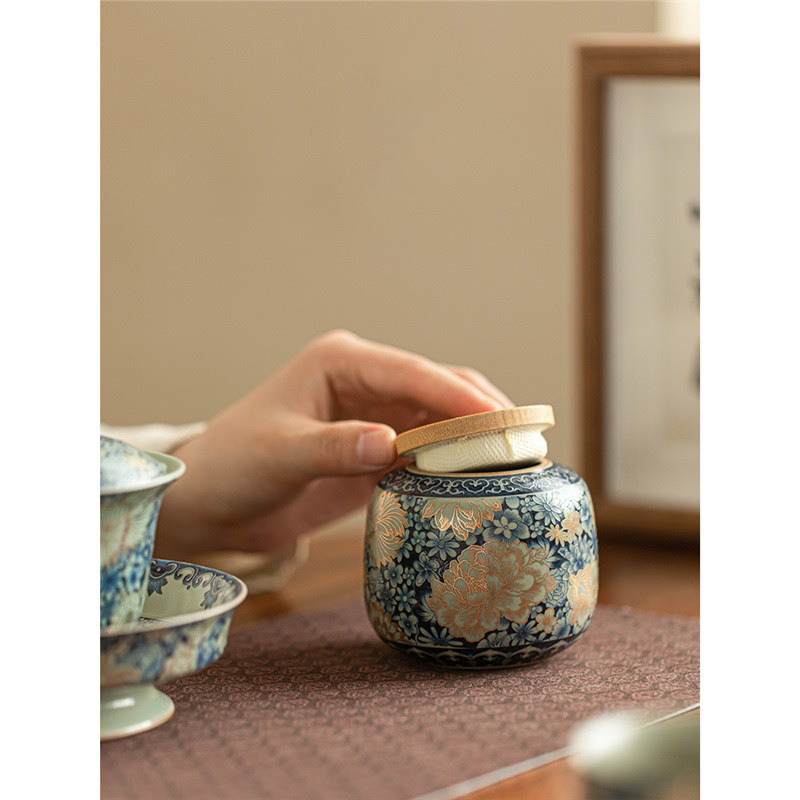 Bình đựng trà hoa Ruyao Bình đựng trà Pu'er nhỏ gia dụng Bình đựng trà gốm sứ cao cấp cầm tay ngoài trời