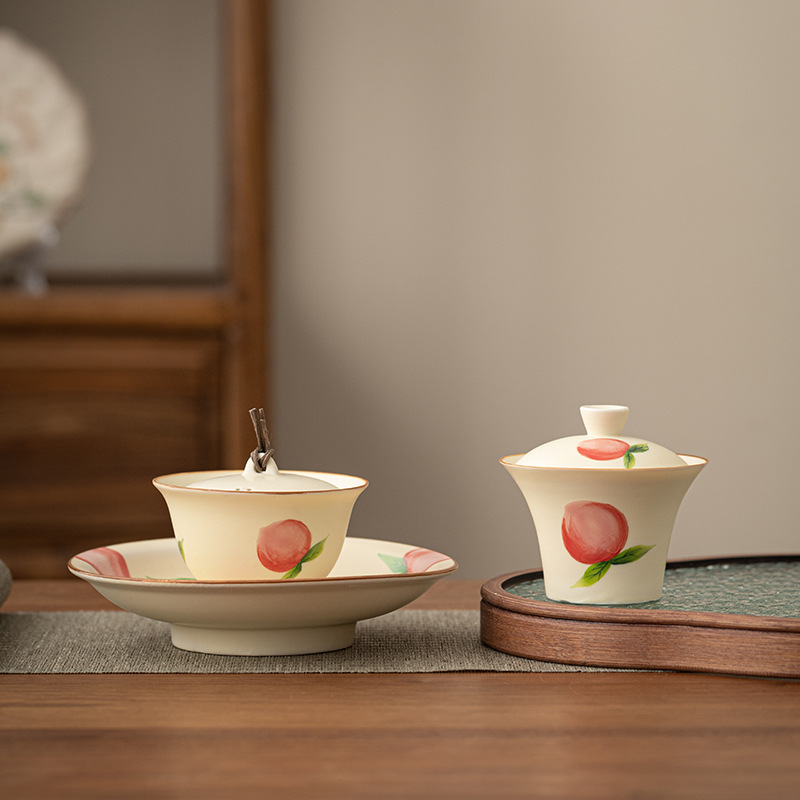 Bộ trà màu vàng kem đào vẽ tay dụng cụ trà Kung Fu sáng tạo gốm sứ gia dụng dễ thương bát trà cốc trà