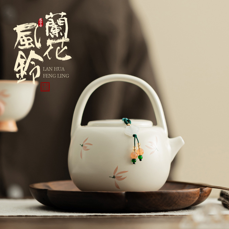 Phong lan chuông gió màu be vàng Ding lò nung chùm ấm pha trà cầm tay gốm sứ dụng cụ pha trà Kung Fu dụng cụ pha trà lỗ bóng dụng cụ pha trà