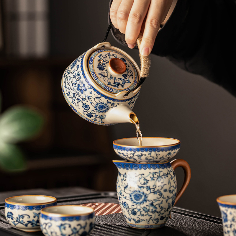 Bộ đồ trà lò vàng xanh trắng ấm trà gốm sứ cao cấp sang trọng nhẹ gia dụng cốc trà Kung Fu trọn bộ quà lưu niệm